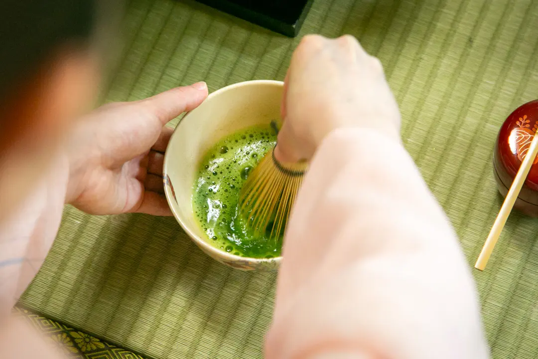 Whisking matcha
